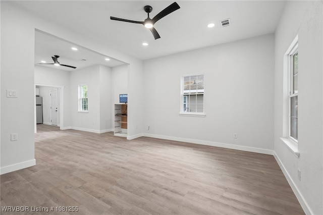 618 Sycamore St, Van Buren, AR 72956 - unfurnished living room with a ceiling fan, recessed lighting, light wood finished floors, and baseboards