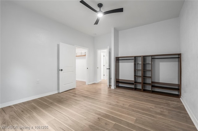 618 Sycamore St, Van Buren, AR 72956 - unfurnished bedroom featuring wood finished floors, baseboards, and ceiling fan