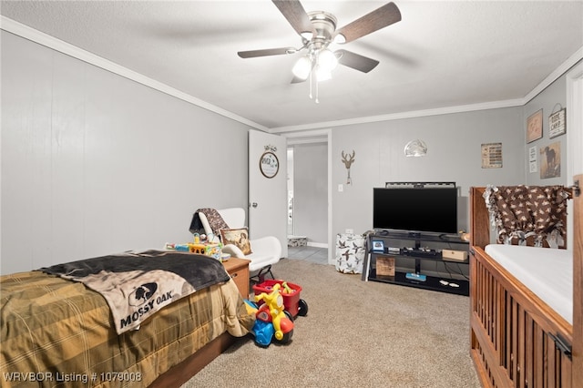 carpeted bedroom with ceiling fan and ornamental molding