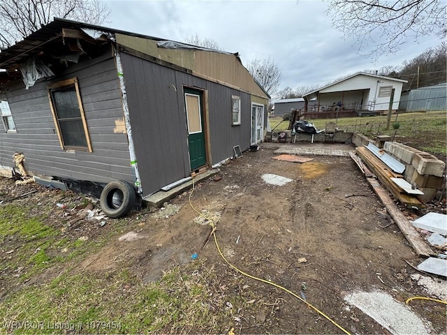 view of property exterior featuring fence