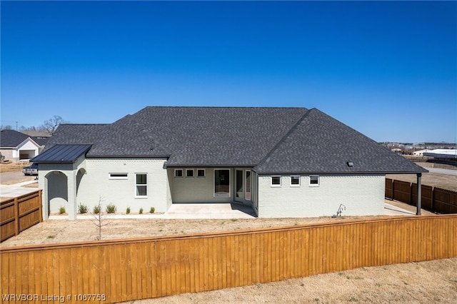 rear view of property featuring a patio