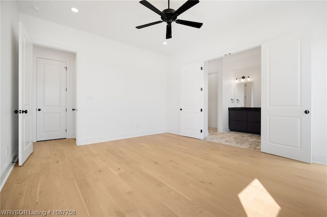 unfurnished bedroom featuring ceiling fan and light hardwood / wood-style flooring