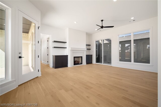 7631 Woodbine Ln, Fort Smith, AR 72916 - unfurnished living room featuring a ceiling fan, light wood finished floors, a fireplace, and recessed lighting