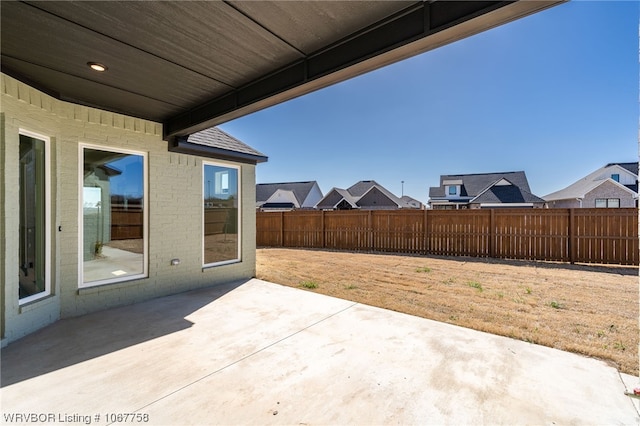 7631 Woodbine Ln, Fort Smith, AR 72916 - fenced backyard with a patio and a residential view