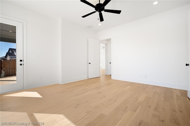 empty room with light wood-type flooring and ceiling fan