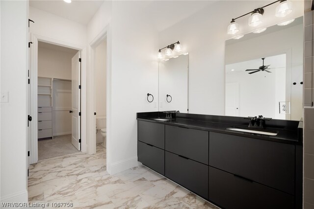 bathroom with ceiling fan, toilet, and vanity