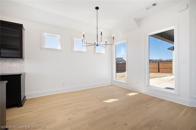 7631 Woodbine Ln, Fort Smith, AR 72916 - unfurnished dining area featuring a chandelier and light wood finished floors