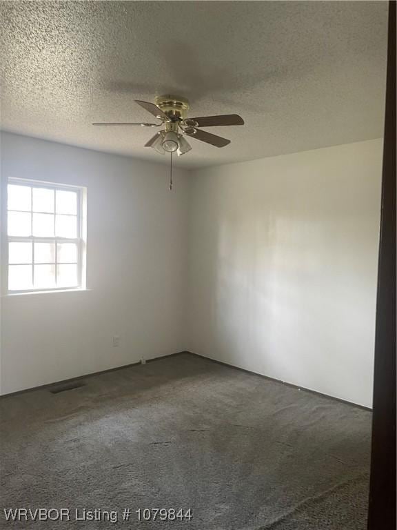 606 Highland Dr, Charleston, AR 72933 - carpeted empty room featuring a textured ceiling and ceiling fan