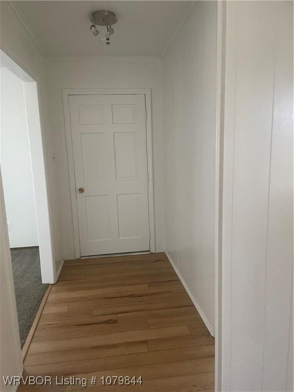 606 Highland Dr, Charleston, AR 72933 - corridor featuring light wood finished floors, baseboards, and ornamental molding