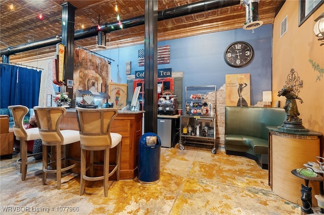 bar featuring concrete flooring