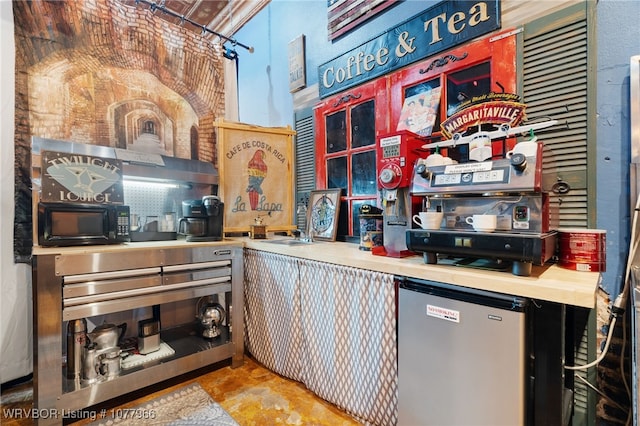 kitchen with oven and fridge