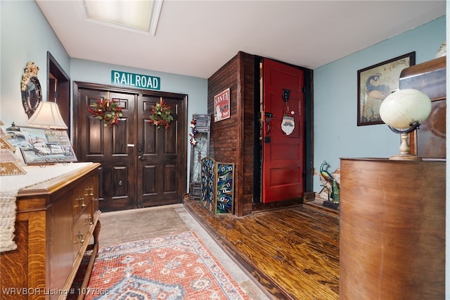 foyer entrance with light hardwood / wood-style floors