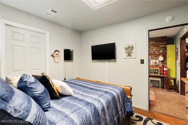 bedroom with light hardwood / wood-style floors