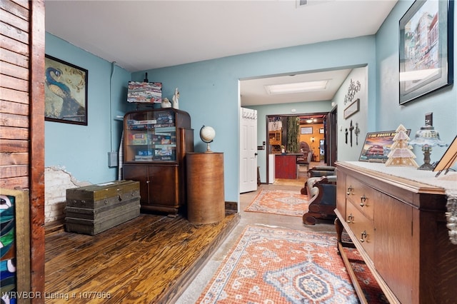 corridor featuring dark hardwood / wood-style floors