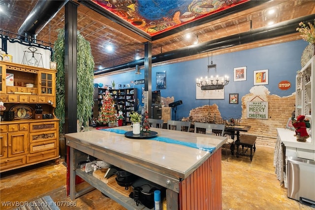 kitchen with hanging light fixtures, a notable chandelier, and brick ceiling