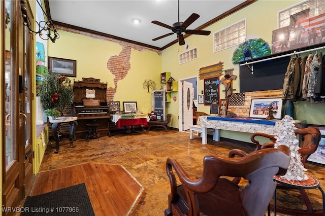 living room featuring ceiling fan and crown molding