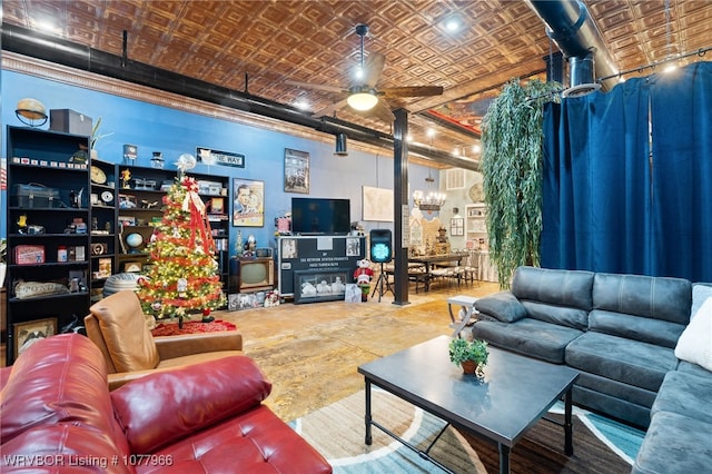 living room with ceiling fan with notable chandelier