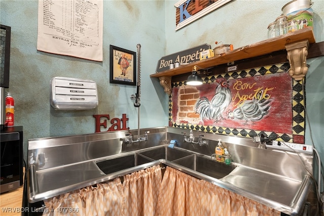 kitchen featuring stainless steel counters and sink