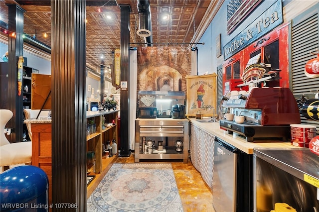 interior space with refrigerator, sink, and brick ceiling