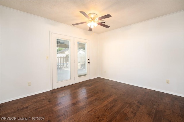 spare room with ceiling fan and dark hardwood / wood-style floors