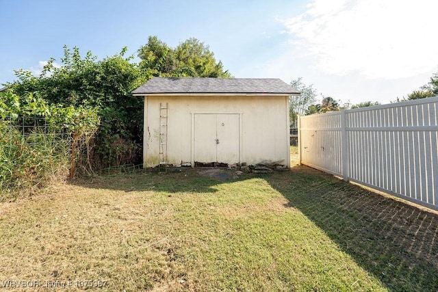 view of outdoor structure with a lawn