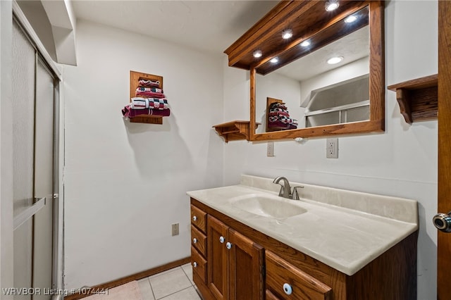 bathroom with tile patterned floors and vanity