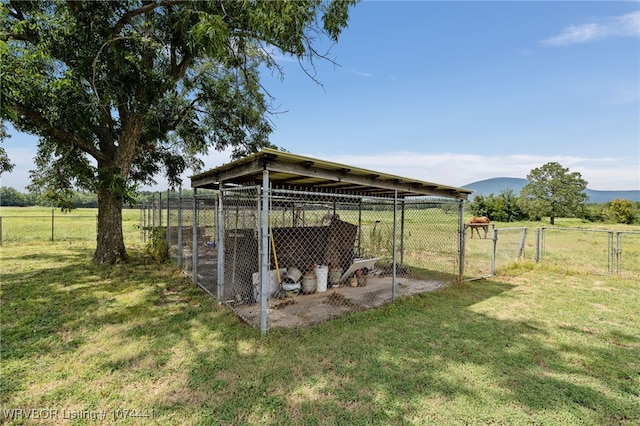 exterior space with a rural view and an outdoor structure