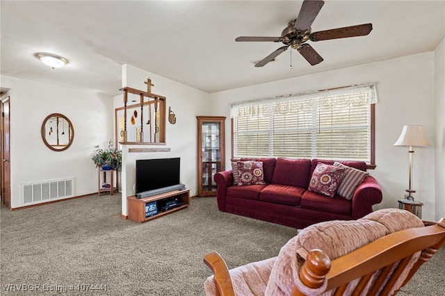 carpeted living room featuring ceiling fan