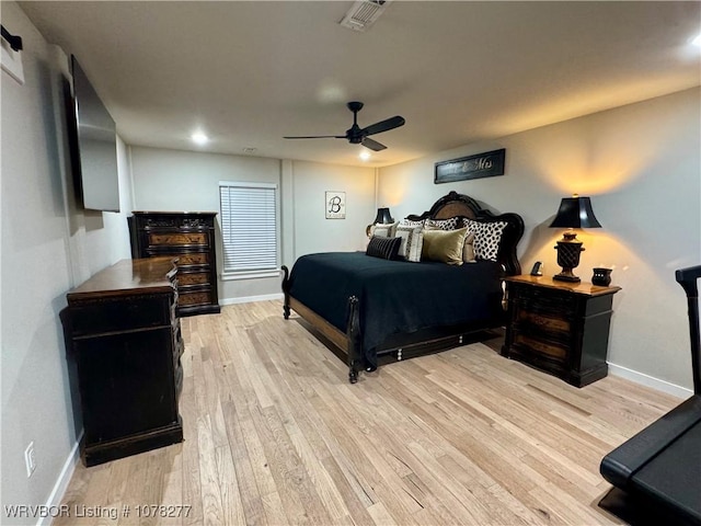 bedroom featuring ceiling fan and light hardwood / wood-style floors