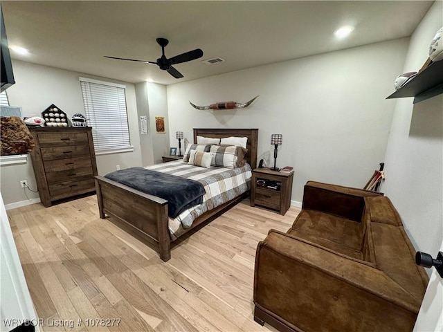 bedroom featuring light hardwood / wood-style flooring and ceiling fan