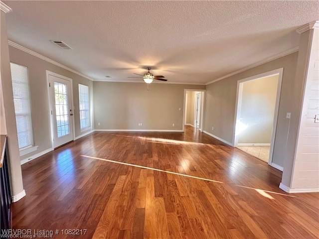 106 E Dora Ln, Poteau, OK 74953 - spare room featuring wood finished floors, ceiling fan, crown molding, and a textured ceiling
