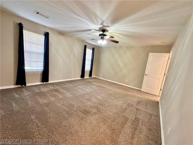 106 E Dora Ln, Poteau, OK 74953 - spare room featuring carpet floors and ceiling fan