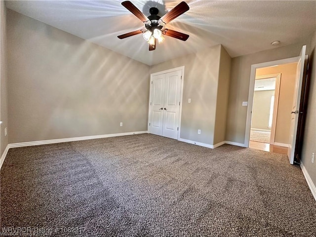 106 E Dora Ln, Poteau, OK 74953 - unfurnished bedroom with carpet floors, a closet, and ceiling fan