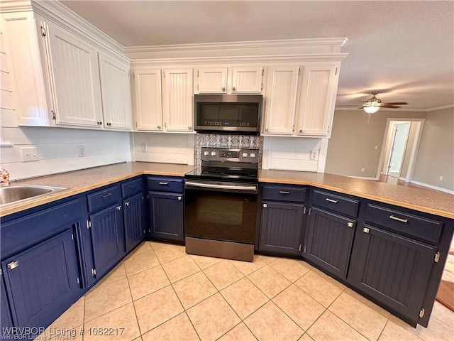 106 E Dora Ln, Poteau, OK 74953 - kitchen featuring stainless steel microwave, black range with electric stovetop, blue cabinets, white cabinetry, and ornamental molding