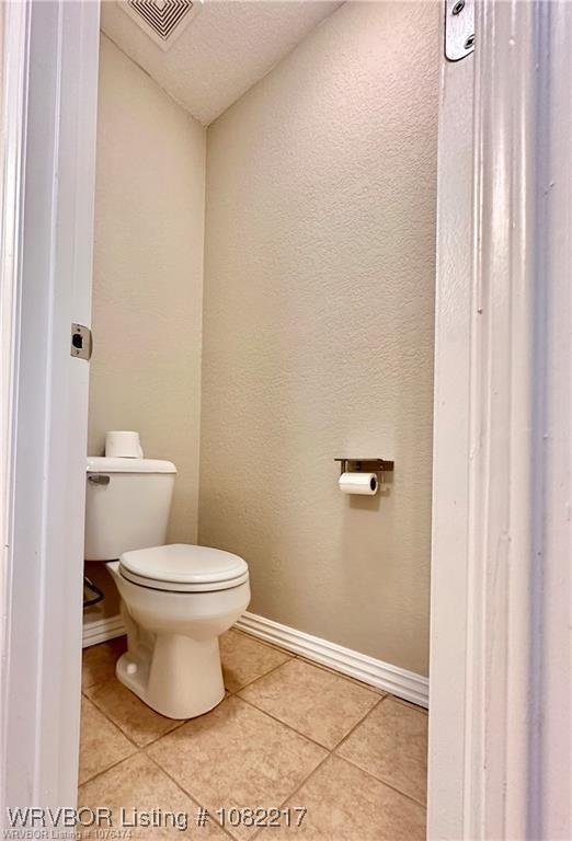 106 E Dora Ln, Poteau, OK 74953 - bathroom featuring tile patterned floors and a textured wall