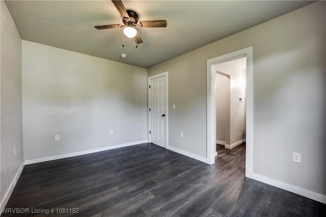 3614 Blair Ave, Fort Smith, AR 70903 - empty room with dark wood-style floors, a ceiling fan, and baseboards