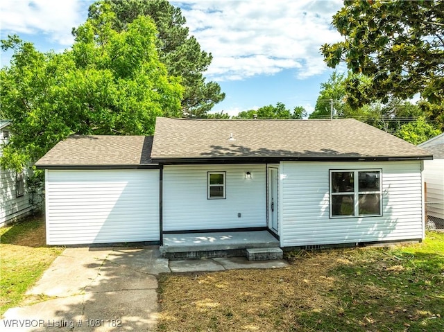 3614 Blair Ave, Fort Smith, AR 70903 - back of property featuring a shingled roof, a patio, and a yard