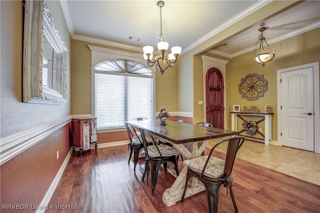 2304 Durango Dr, Van Buren, AR 72956 - dining space featuring a chandelier, wood finished floors, crown molding, and baseboards
