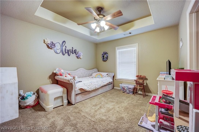 2304 Durango Dr, Van Buren, AR 72956 - carpeted bedroom with a tray ceiling, ceiling fan, and baseboards