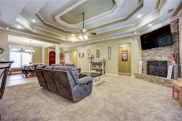 2304 Durango Dr, Van Buren, AR 72956 - living area with crown molding, carpet, a fireplace with raised hearth, a chandelier, and a ceiling fan