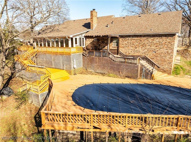 view of pool featuring a wooden deck