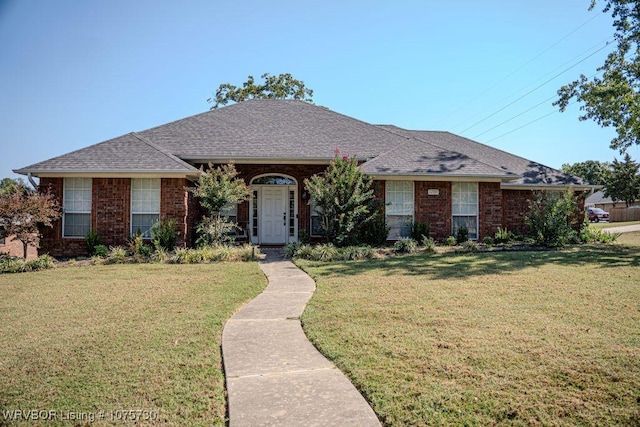 ranch-style house with a front lawn