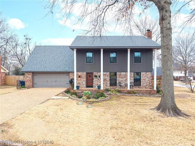 view of front facade with a garage and a front yard