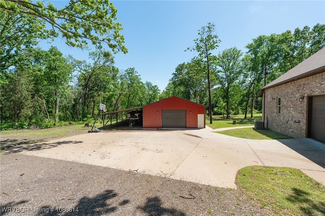 garage featuring central AC and a detached garage