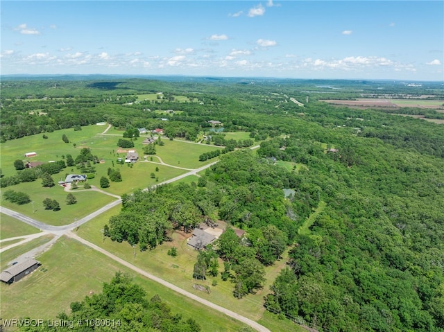 bird's eye view featuring a wooded view