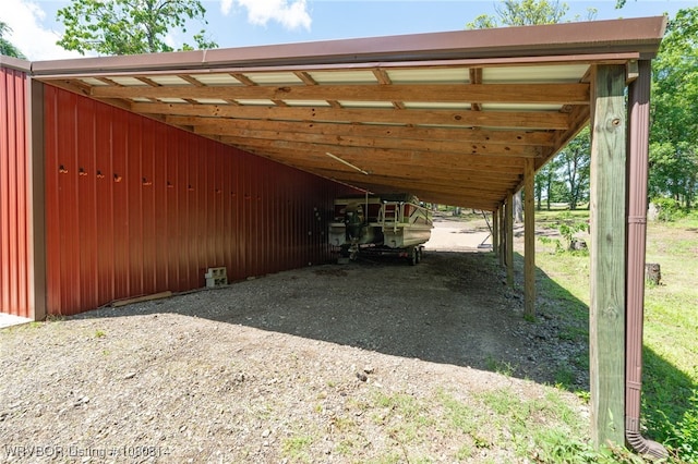 view of parking featuring dirt driveway