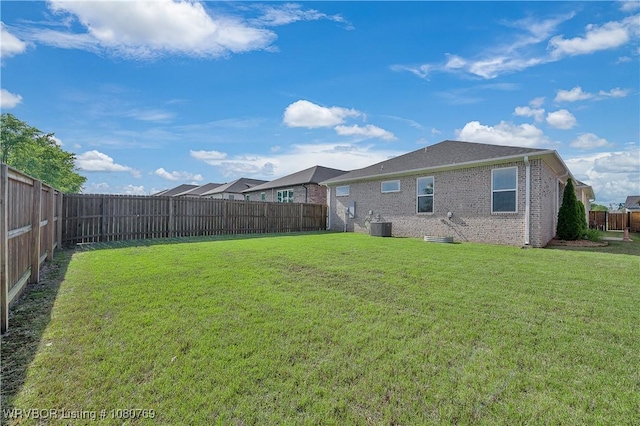 9100 Kirkwood Rd, Fort Smith, AR 72916 - view of yard featuring central AC and a fenced backyard