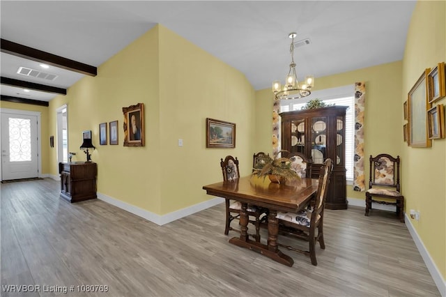 9100 Kirkwood Rd, Fort Smith, AR 72916 - dining space featuring light wood finished floors, an inviting chandelier, visible vents, and a healthy amount of sunlight