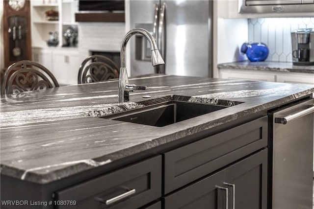 9100 Kirkwood Rd, Fort Smith, AR 72916 - kitchen with a sink, gray cabinetry, tasteful backsplash, and appliances with stainless steel finishes