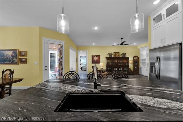 9100 Kirkwood Rd, Fort Smith, AR 72916 - kitchen featuring stainless steel fridge, decorative light fixtures, white cabinets, recessed lighting, and glass insert cabinets